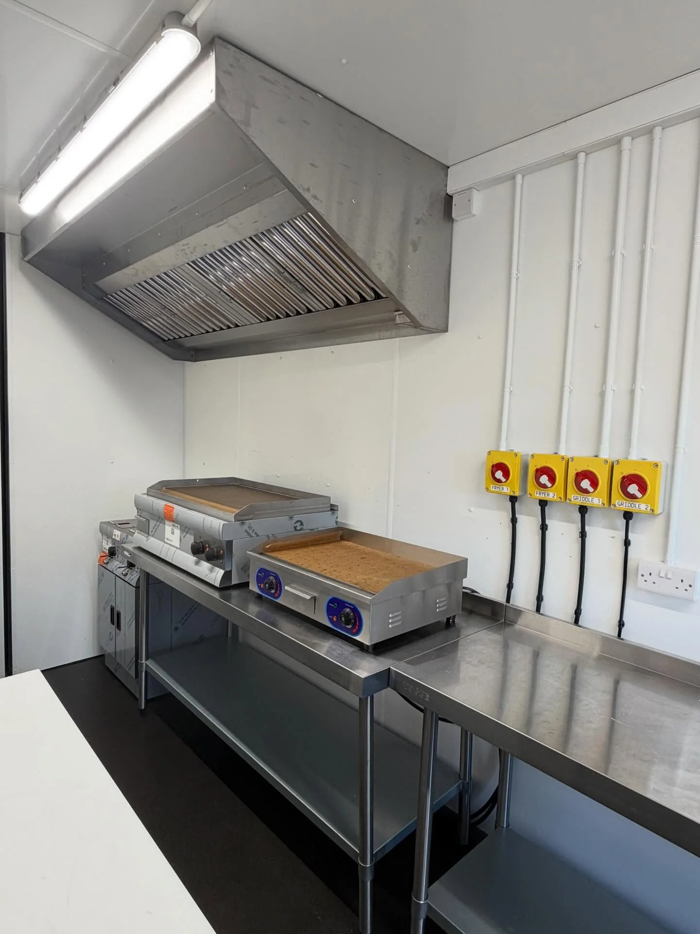 Commercial kitchen electrical installation with isolator switches