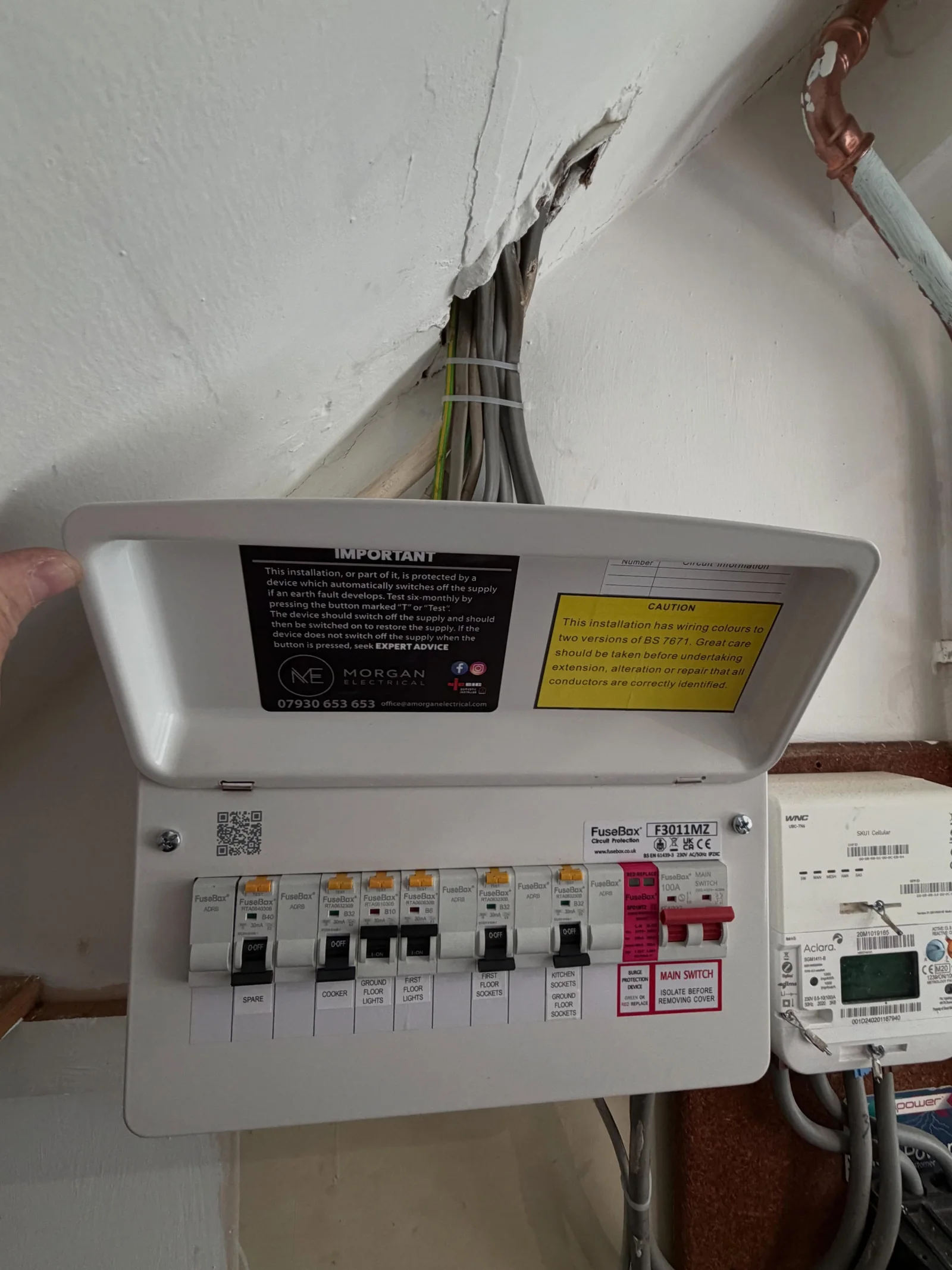 Morgan Electrical consumer unit beside an electricity meter